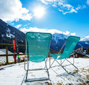 Scenic view of snowcapped mountains during sunny day