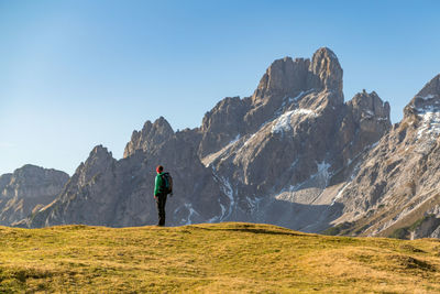 Man on mountain against sky