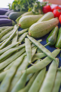 Close-up of green chili peppers for sale at market stall