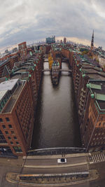 High angle view of river amidst buildings in city hamburg speicherstadt 