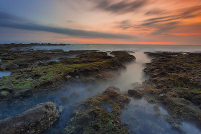 Scenic view of sea against sky during sunset