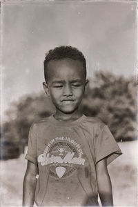 Portrait of boy standing outdoors