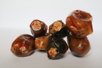 Close-up of fruits against white background