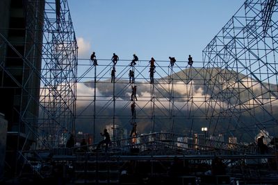 Construction workers setting up concert stage