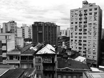 High angle view of buildings in city against sky