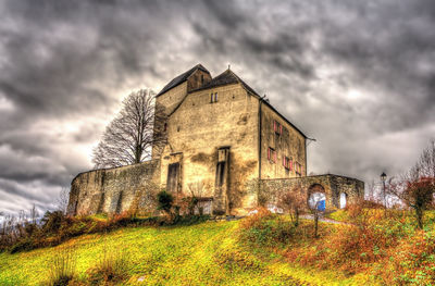 Abandoned building against sky