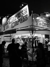 People on city street at night