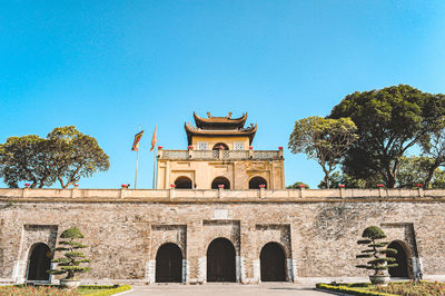 Low angle view of historical building against blue sky