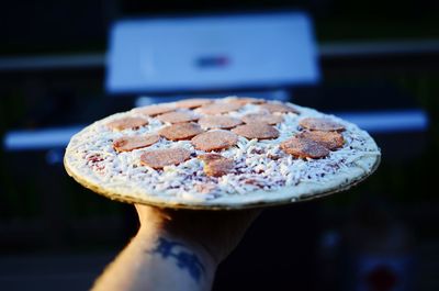 Close-up of hand holding ice cream