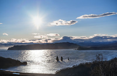 Scenic view of sea against sky on sunny day
