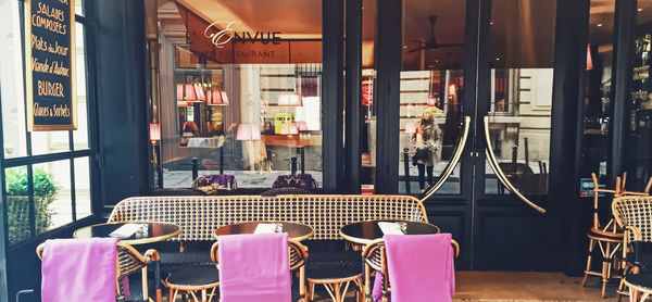 Empty chairs and tables in cafe