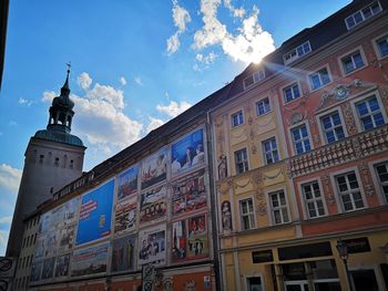 Low angle view of building against cloudy sky