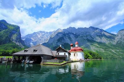 Scenic view of lake and mountains against sky