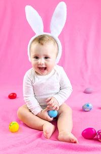 Portrait of cute girl playing with toy blocks