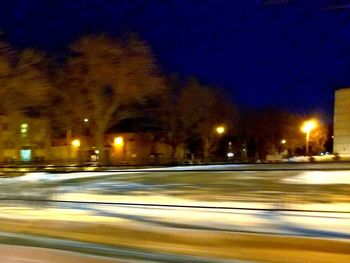 Illuminated street at night in winter