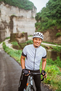 Portrait of man riding bicycle