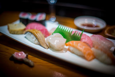 Close-up of sushi served on table