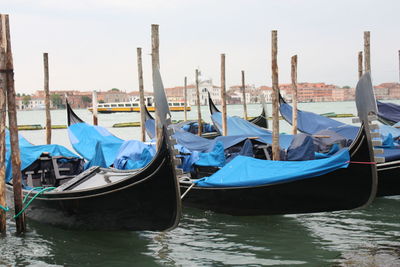 Boats moored in canal