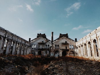 Low angle view of old building against sky