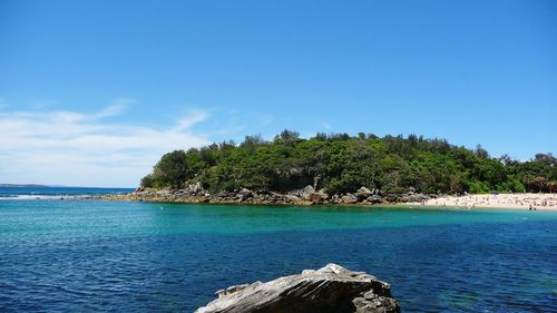 Scenic view of sea against clear blue sky