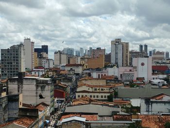 High angle view of buildings in city against sky