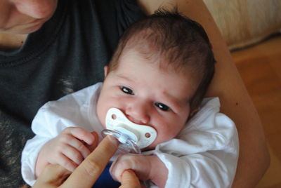 Close-up of mother and baby at home