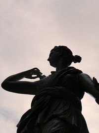 Low angle view of statue against sky