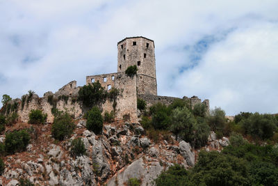 Low angle view of old building against sky