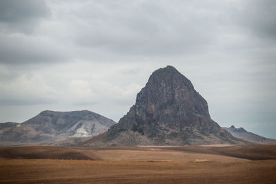 Scenic view of landscape and mountains against sky