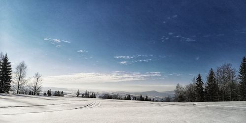 Scenic view of landscape against sky during winter