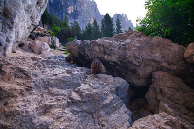 Rock formation on mountain against sky