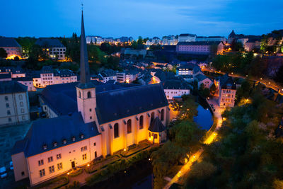 High angle view of illuminated buildings in city at night