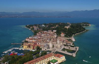 High angle view of townscape by lake garda sirmione italy