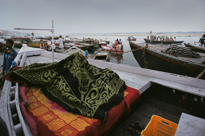 Boats moored at harbor