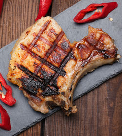 High angle view of meat on barbecue grill