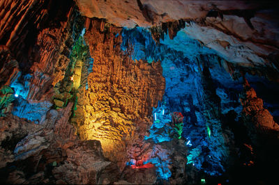 Low angle view of illuminate rock formation in cave