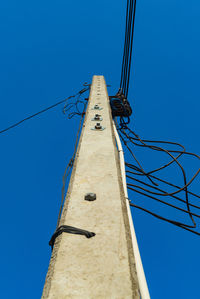 Low angle view of tower against clear blue sky