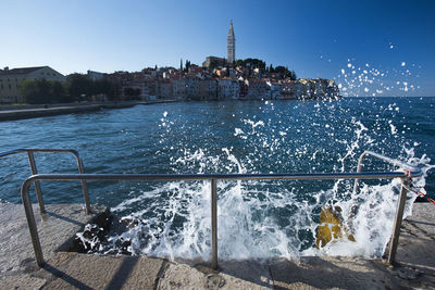 View of buildings by sea