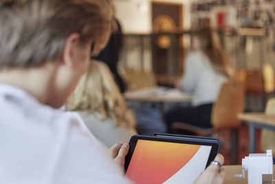 Student using tablet in class