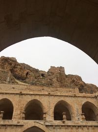 Low angle view of old building against clear sky