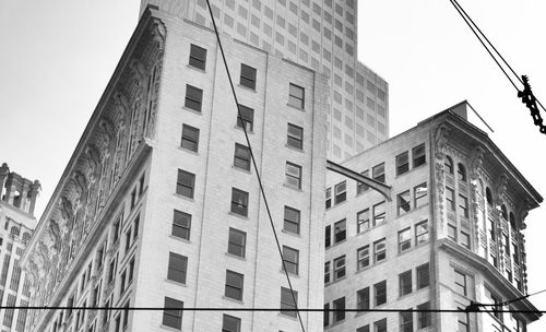 Low angle view of buildings against clear sky