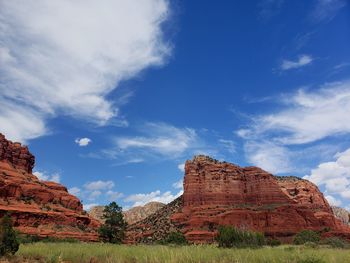 Low angle view of rock formations against sky