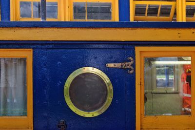Close-up of yellow window of building