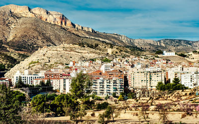 Panoramic view of trees and mountains against sky