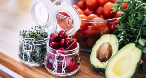 Close-up of fruits in glass jar on table