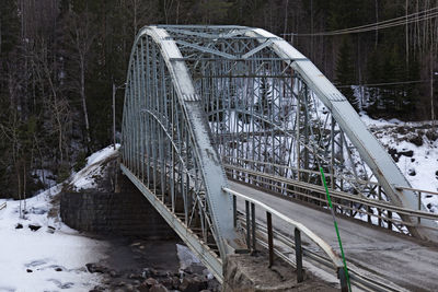 Bridge over frozen lake during winter