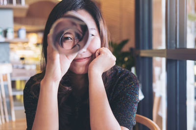 Portrait of young woman in restaurant