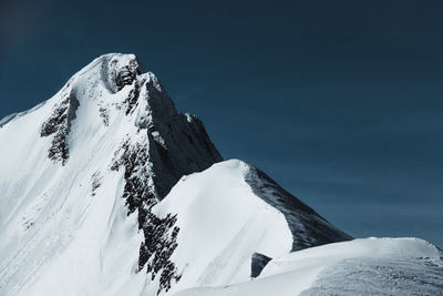 Snow covered mountain against sky