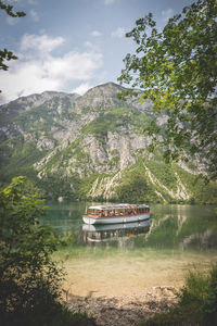 Boat in lake against sky