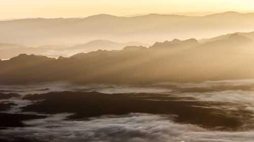 Scenic view of mountains against sky during sunset